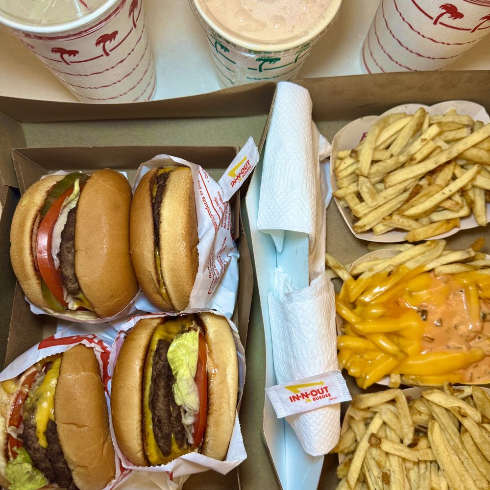 Two Double-Double's, and two Single's. Fries both plain and animal-style, no onions. Two Double-Double's, and two Single's. Fries both plain and animal-style, no onions.