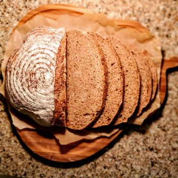 Bread of Life Bakery - a loaf of bread on a cutting board - Bakeries Near Me - Virginia Beach, Virginia Bread of Life Bakery - a loaf of bread on a cutting board - Bakeries Near Me - Virginia Beach, Virginia