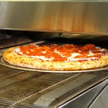 QuikTrip - a pizza cooking in an oven - Convenience Stores Near Me - Stockbridge, Georgia