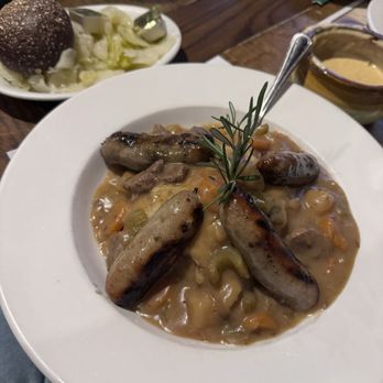 Meg O'Malley's - Bangers mash substitute Irish potato soup instead of brown gravy, with a side of butter, cabbage, and pumpernickel roll - Pubs Near Me - Melbourne, Florida