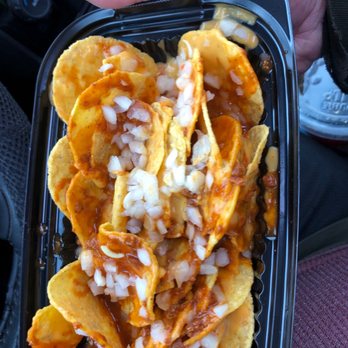 7-Eleven - a hand holding a container of nachos - Convenience Stores Near Me - Fraser, Michigan 7-Eleven - a hand holding a container of nachos - Convenience Stores Near Me - Fraser, Michigan