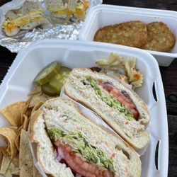 Coopersburg Bagels & Deli - Back: egg & cheddar on everything bagel w/ hashbrowns Front: tuna on a Kaiser roll with pickles on side, pasta salad (YUM!) & tortilla chips