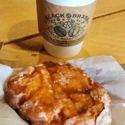 Black & Brass Coffee Roasting - Delicious apple fritter along with really good cup of coffee .