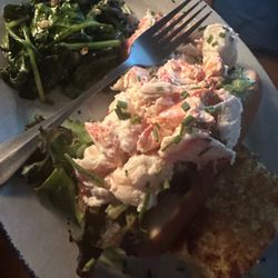 Clod lobster roll brimming with lobster chunks.