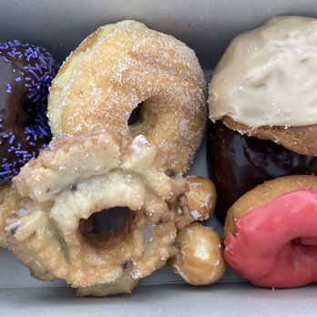 Sovanna's Donuts - Chocolate cake with purple sprinkles. Maple  old fashioned filled deep fried upper right. Strawberry  glazed cake. - Donuts Near Me - Gustine, California