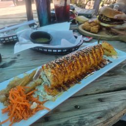 The Criminal is a crab, shrimp avocado in an eel sauce. Along size was a pickled onion and carrot and a chili tornado. The Criminal is a crab, shrimp avocado in an eel sauce. Along size was a pickled onion and carrot and a chili tornado.