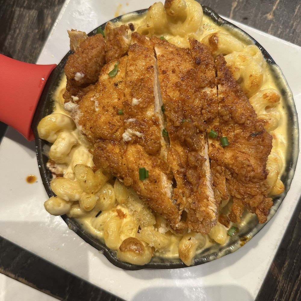 The Stillery - Nashville hot Mac n' Cheese Topped with Hot Chicken - New American Near Me - Nashville, Tennessee The Stillery - Nashville hot Mac n' Cheese Topped with Hot Chicken - New American Near Me - Nashville, Tennessee