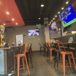 East Coast Wings + Grill - Bar area/lots of tvs