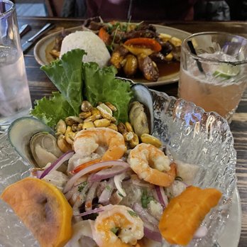 Pisco Latin Kitchen - Mixto Ceviche (Rosa Negra mezcal cocktail and lomo saltado in the background) - Latin American Near Me - Sandy Springs, Georgia Pisco Latin Kitchen - Mixto Ceviche (Rosa Negra mezcal cocktail and lomo saltado in the background) - Latin American Near Me - Sandy Springs, Georgia