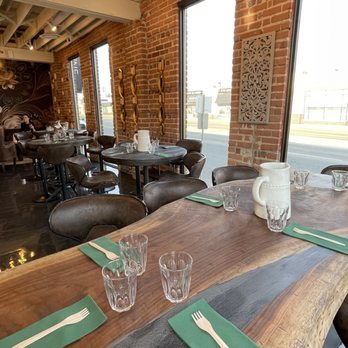 La Prosciutteria - a table with place settings - Italian Near Me - Edmonton, Alberta La Prosciutteria - a table with place settings - Italian Near Me - Edmonton, Alberta
