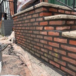 Bonillas Brick Pointing and Concrete - Brick stoop that got 15 brick relaid and replaced also grinded out old mortar and repointed with new limey charcoal gray mortar