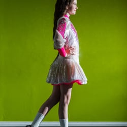 The Kelly School of Irish Dance - A champion Kelly Irish Dancer poses in her solo dress at the KSID Coventry Studio.