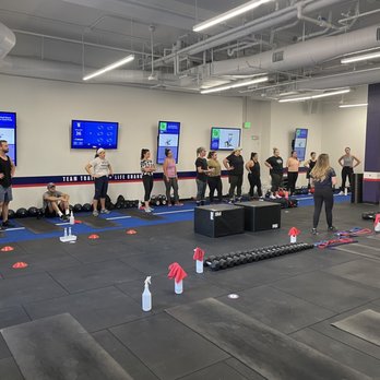 F45 Training - Coaches explaining the workout for the day to members. - Trainers Near Me - Sacramento, California
