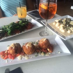 SS106 Aperitivo Bar - Arancini, salcichia, and gnocchi... Paired with their delicious spritzers !