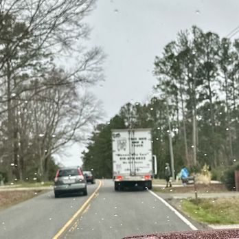 Two Men and a Truck Moving and Storage - Parked on a two lane on a hill! So for anyone needing to go around it's less safe! - Packing Services Near Me - Cary, North Carolina Two Men and a Truck Moving and Storage - Parked on a two lane on a hill! So for anyone needing to go around it's less safe! - Packing Services Near Me - Cary, North Carolina