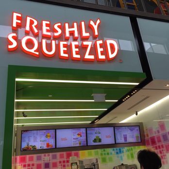 Freshly Squeezed - a neon sign for a restaurant - Fruits & Veggies Near Me - North York, Ontario