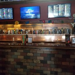 a bar with a brick wall