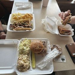 Our food! Cuban with Mac & Cheese; pulled pork sandwich with potato salad and coleslaw & pickle; grilled cheese with brisket!