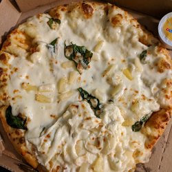 Domino's Pizza - Ordered an Alfredo pizza with pineapple and spinach. There were 2 pieces of spinach & the cheese was all over the place.