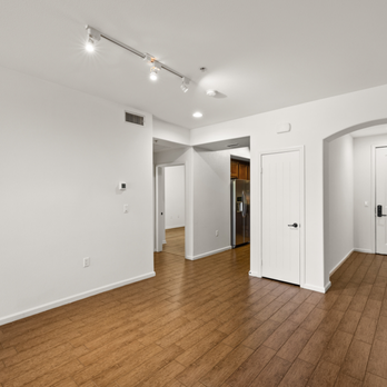 Le Blanc Apartments - Large living room with wood plank style flooring, high ceilings and balcony. - Apartments Near Me - Canoga Park, California Le Blanc Apartments - Large living room with wood plank style flooring, high ceilings and balcony. - Apartments Near Me - Canoga Park, California