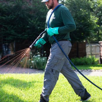 Aggieland Green - a man using a lawn mower - Lawn Services Near Me - Tomball, Texas