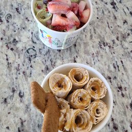 ows a bowl of fruit and a bowl of cookies