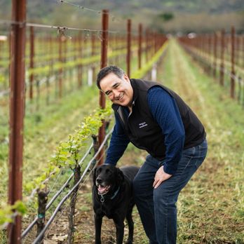 Trujillo Wines - a man and his dog in a vineyard - Wine Tasting Room Near Me - Saint Helena, California Trujillo Wines - a man and his dog in a vineyard - Wine Tasting Room Near Me - Saint Helena, California