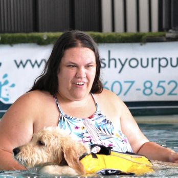 Splash Your Pup - Woman in water with dog swimming - Pet Training Near Me - Moraine, Ohio