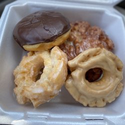The Ultimate Doughnut Shop - Apple Fritter, chocolate with custard fill, maple and old fashioned glazed donuts