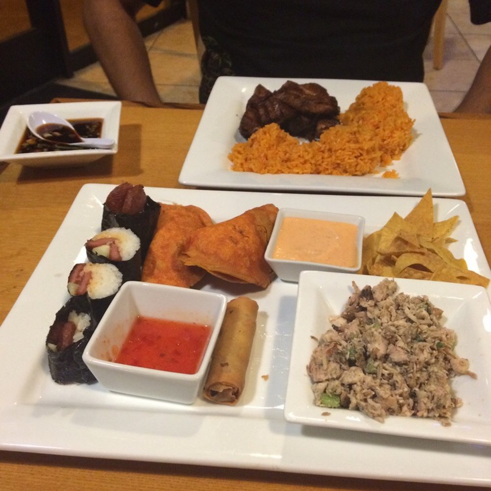 Guahan Grill - In the front is the sampler platter and in the background is the chomorro deep fried ribs. - Barbeque Near Me - Oceanside, California Guahan Grill - In the front is the sampler platter and in the background is the chomorro deep fried ribs. - Barbeque Near Me - Oceanside, California