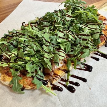 Pinsa 104 - Pinsa with prosciutto, arugula, and balsamic reduction. - Pizza Near Me - Davie, Florida