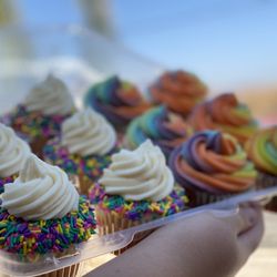Vanilla Rainbow Rim cupcake!  Vanilla Cupcake with sprinkles and topped off with Cream Cheese Frosting!