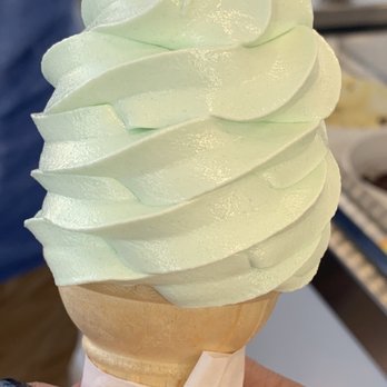Marshall's Ice Cream Bar - a hand holding an ice cream cone - Ice Cream & Frozen Yogurt Near Me - Massapequa, New York Marshall's Ice Cream Bar - a hand holding an ice cream cone - Ice Cream & Frozen Yogurt Near Me - Massapequa, New York