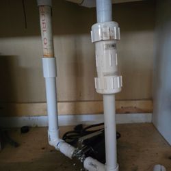 White Mountain Property Care - Replaced plumbing and sump pump to a garage sink!