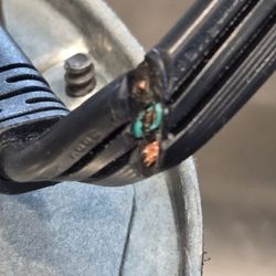 Pulte Homes - kitchen waste disposal cord cut to the copper. hidden at the cord backside. not visible from front. discovered after 3+ years in the house.