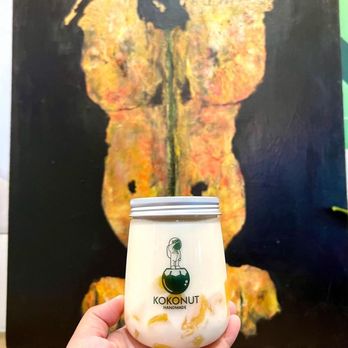 KOKONUT - Cloud Kitchen - a hand holding a jar of yogurt - Desserts Near Me - Anaheim, California KOKONUT - Cloud Kitchen - a hand holding a jar of yogurt - Desserts Near Me - Anaheim, California