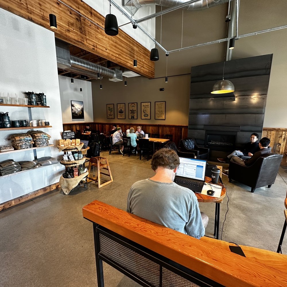 Woods Coffee - Left side of seating area. Notice the fire - Coffee & Tea Near Me - Bothell, Washington