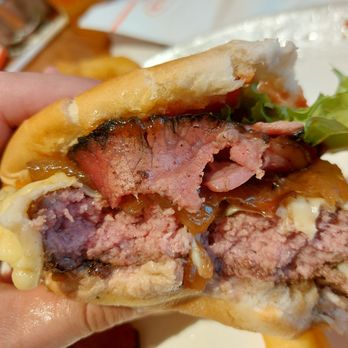 Junior's Restaurant & Bakery - Inside of a Medium Pastrami Swiss Cheeseburger - American Near Me - New York, New York Junior's Restaurant & Bakery - Inside of a Medium Pastrami Swiss Cheeseburger - American Near Me - New York, New York