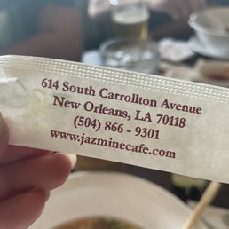 a person holding a ticket for a meal a person holding a ticket for a meal