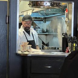 Cook at work through a window