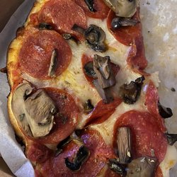 Donna D's Family Pizza - Small thin crust with pepperoni and mushrooms.