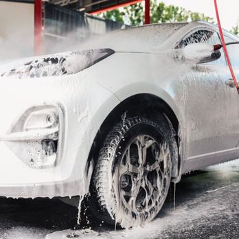Superior Septic And Clean Can - A white SUV is being washed at a professional car wash, covered in thick, dripping cleaning foam... - Septic Services Near Me - Round Rock, Texas Superior Septic And Clean Can - A white SUV is being washed at a professional car wash, covered in thick, dripping cleaning foam... - Septic Services Near Me - Round Rock, Texas