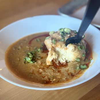 The Biscuit Joint - Chorizo biscuits and gravy topped with green onions - Breakfast & Brunch Near Me - Saint Louis, Missouri The Biscuit Joint - Chorizo biscuits and gravy topped with green onions - Breakfast & Brunch Near Me - Saint Louis, Missouri