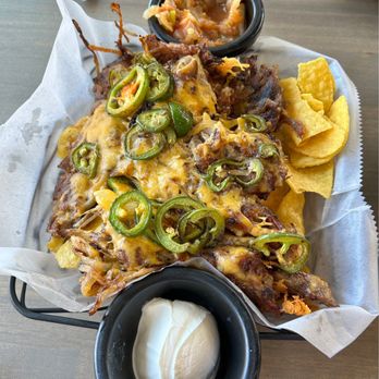 Rising Tide Tavern - Delicious pulled pork nachos! No skimping on the pork or the jalapeños. :) Our server brought us a second salsa, too (not pictured). - American Near Me - Pacific Beach, Washington Rising Tide Tavern - Delicious pulled pork nachos! No skimping on the pork or the jalapeños. :) Our server brought us a second salsa, too (not pictured). - American Near Me - Pacific Beach, Washington