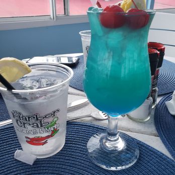 Harbor Crab - Blue Parrot cocktail and ice water with lemon - American Near Me - Patchogue, New York Harbor Crab - Blue Parrot cocktail and ice water with lemon - American Near Me - Patchogue, New York