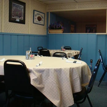 Goal Post Pizza - a dining room with tables and chairs - Pizza Near Me - Birch Run, Michigan
