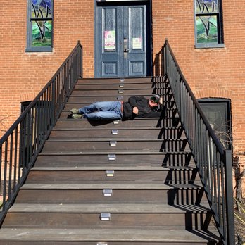 Pirtle Winery - a man laying on the steps of a building - Wineries Near Me - Weston, Missouri Pirtle Winery - a man laying on the steps of a building - Wineries Near Me - Weston, Missouri