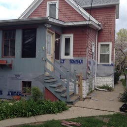 The back porch, soon after siding work began. You can see the old cedar shingle siding with chipping paint.
