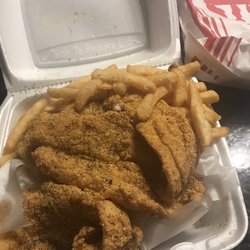 JJ Fish & Chicken - Ok so I opened my lid and there is about 4 large pieces of catfish fillets and fries.  Crunchy and freshly cooked not to much lemon pepper.