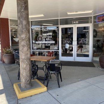 Albany Antique Mall - Front entrance with a refurbished table that was previously a singer brand sewing table - Antiques Near Me - Albany, Oregon